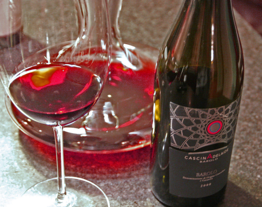 A bottle of Barolo with a decanter at Cascina Adelaide, Piedmont